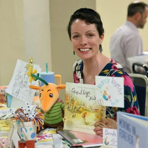 Kim Newton tabling with "Goodbye Sister" at a library event, 2024.